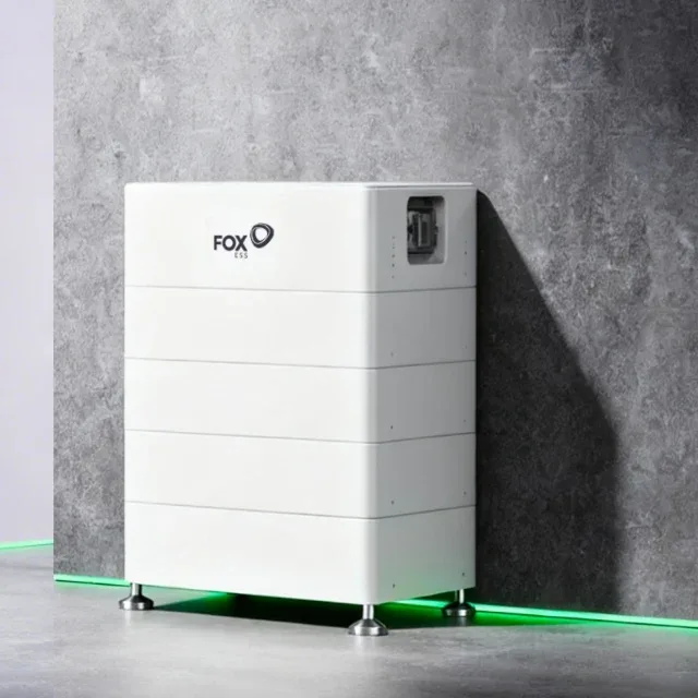Fox ESS EQ series battery stack against a concrete wall