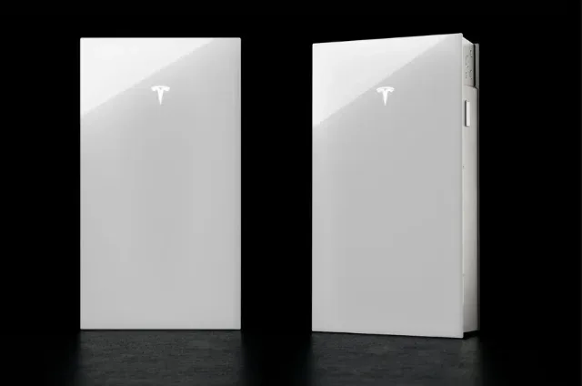 Two Tesla Powerwall 3 units side by side on a dark studio backdrop